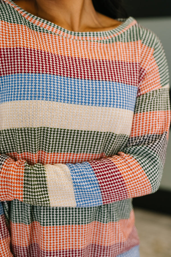Close-up of a colorful checkered dress with a blurred background