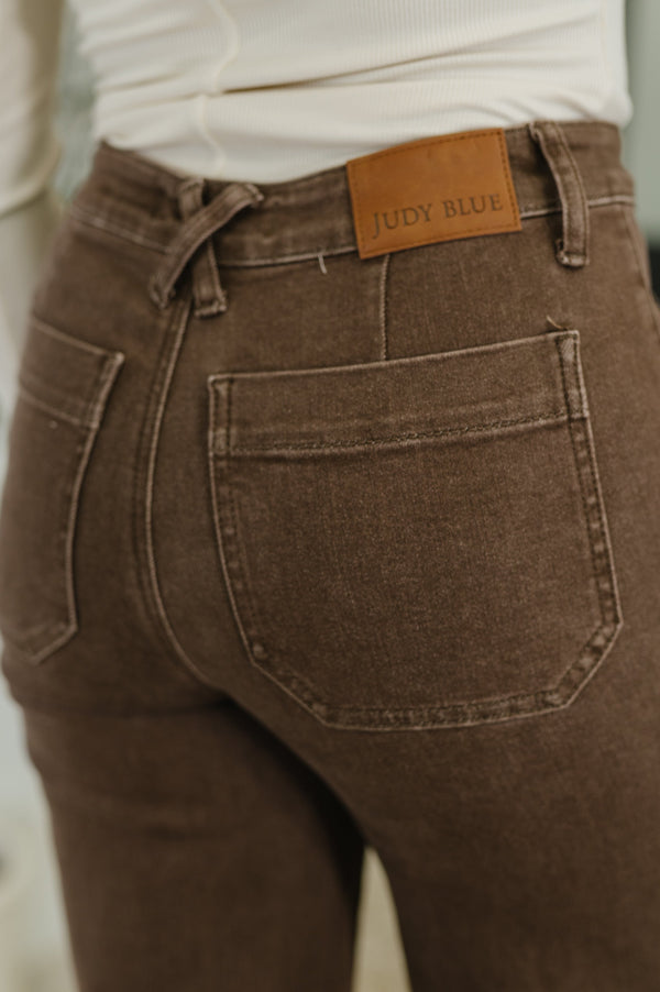 Brown jeans with a Judy Blue label on the back pocket.