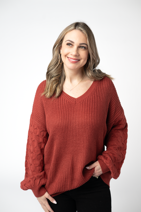 Woman wearing a red sweater on a white background