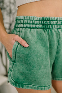 Green shorts with a blurred background