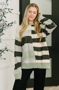 Woman wearing a striped sweater in a home setting