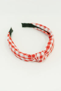 Red and white checkered headband on a white background