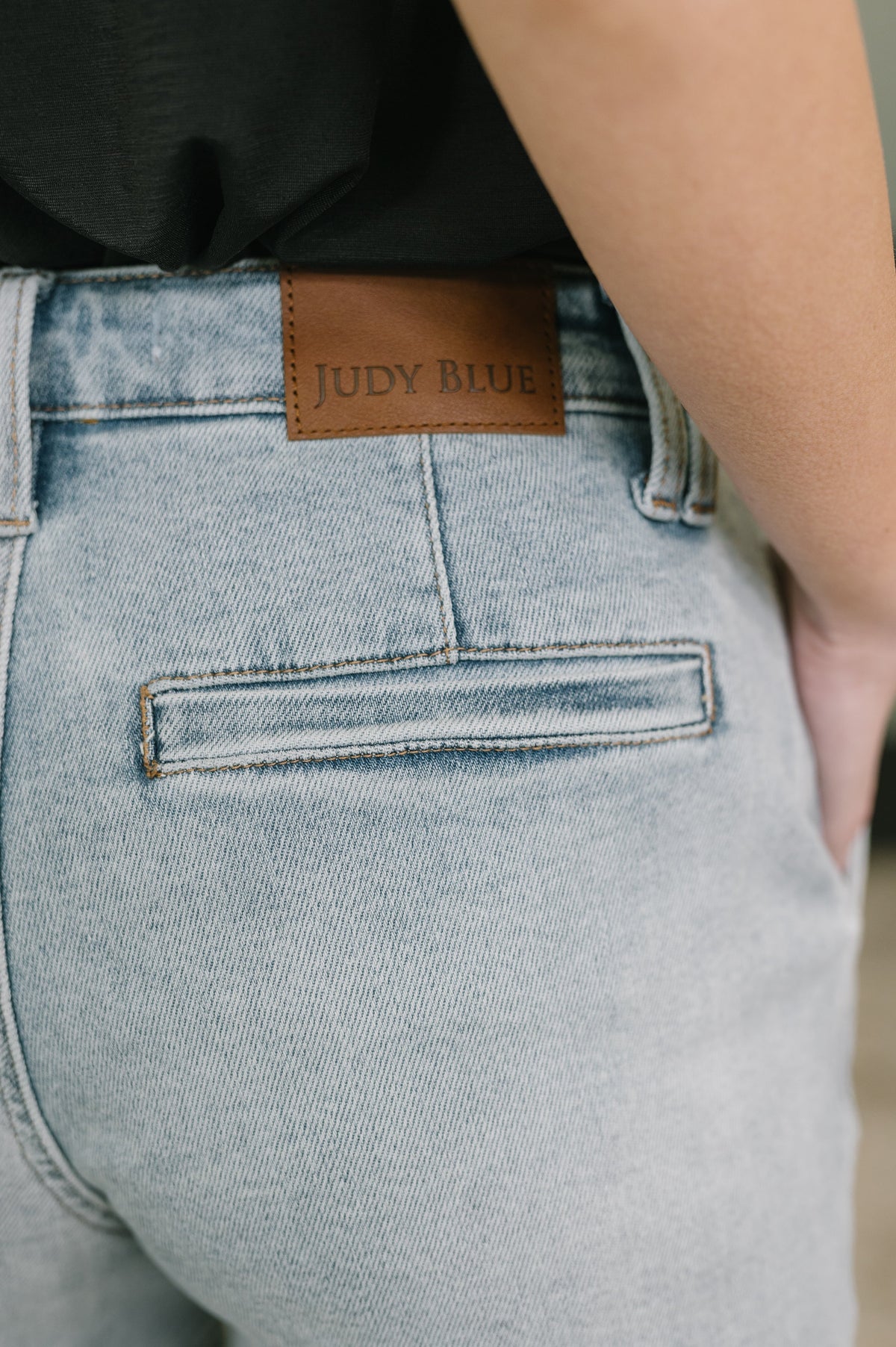 Light blue jeans with a Judy Blue label on the back pocket.
