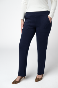 Navy blue pants worn by a person on a white background